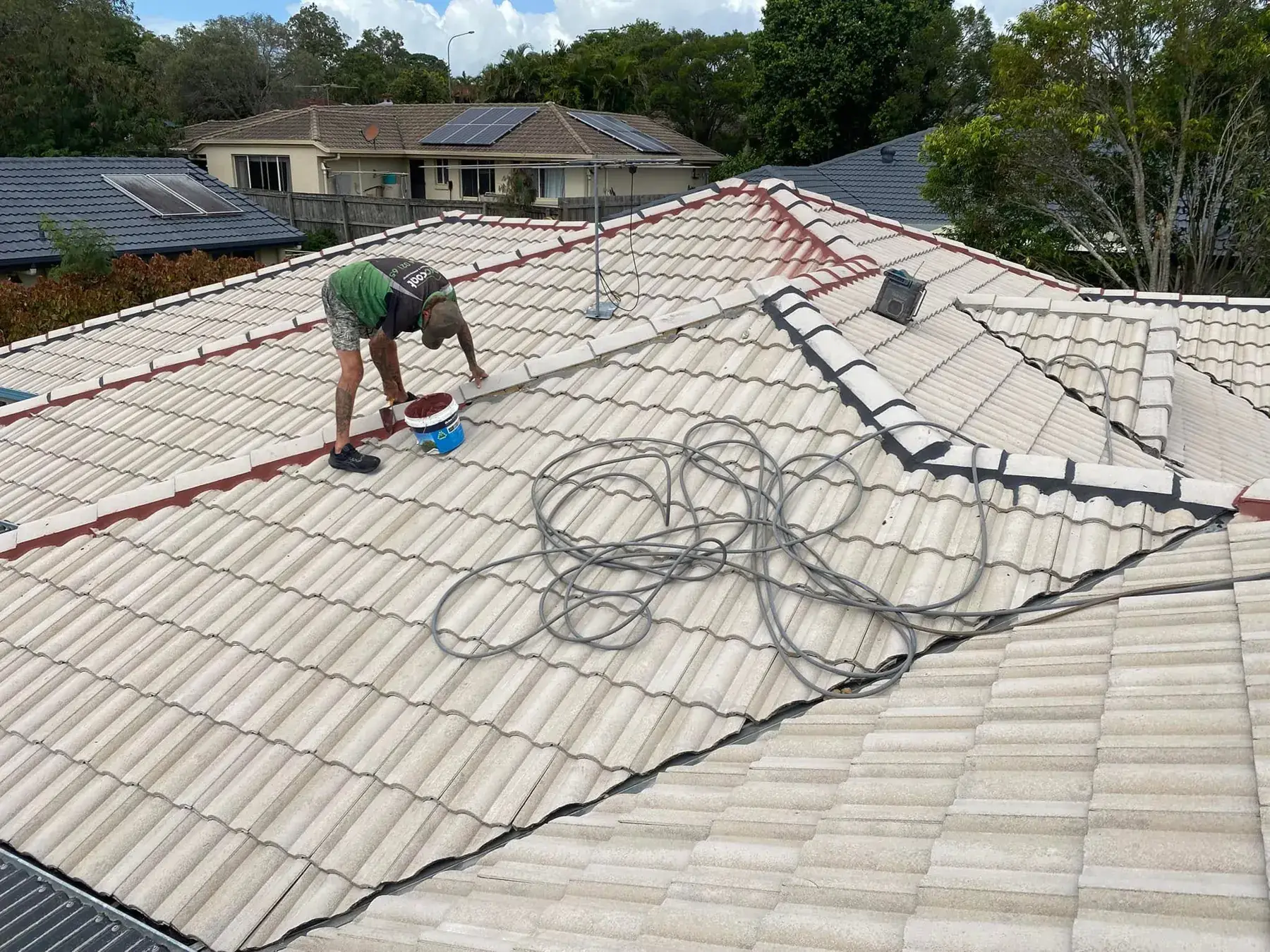 Working on a tile roof at Shailer Park before coating