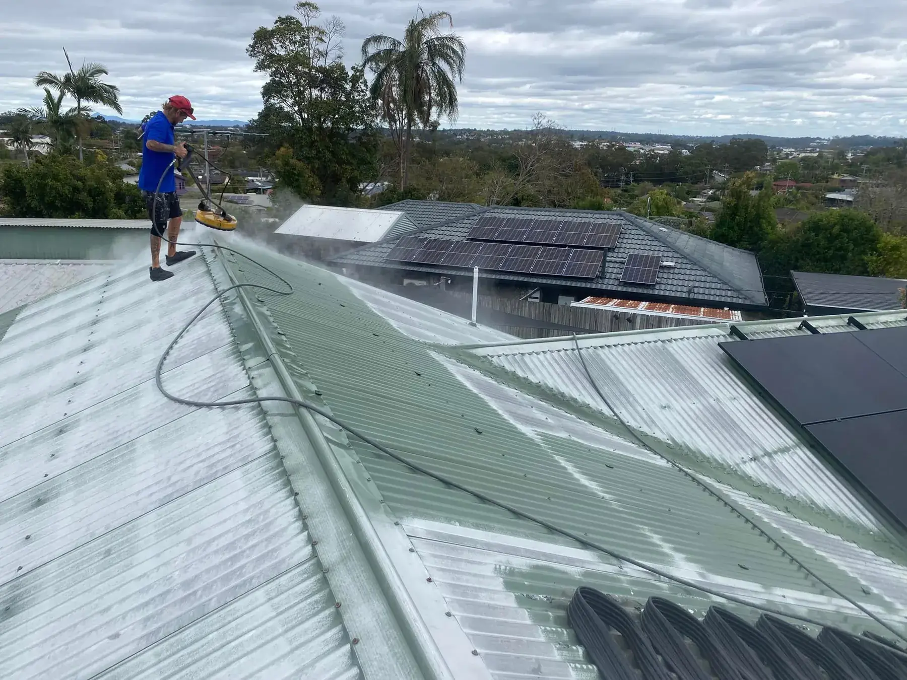 Pressure cleaning a metal roof in Springwood