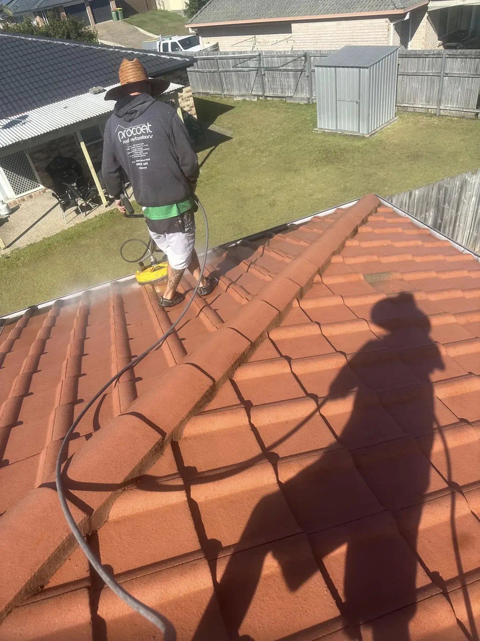 Pressure cleaning a terracotta tile roof