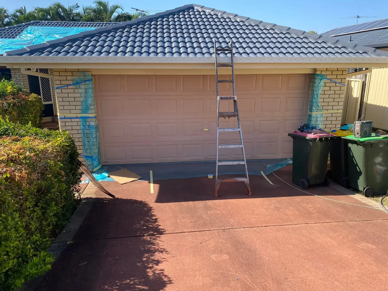 Garage door in Drewvale repainted to go with the restored roof
