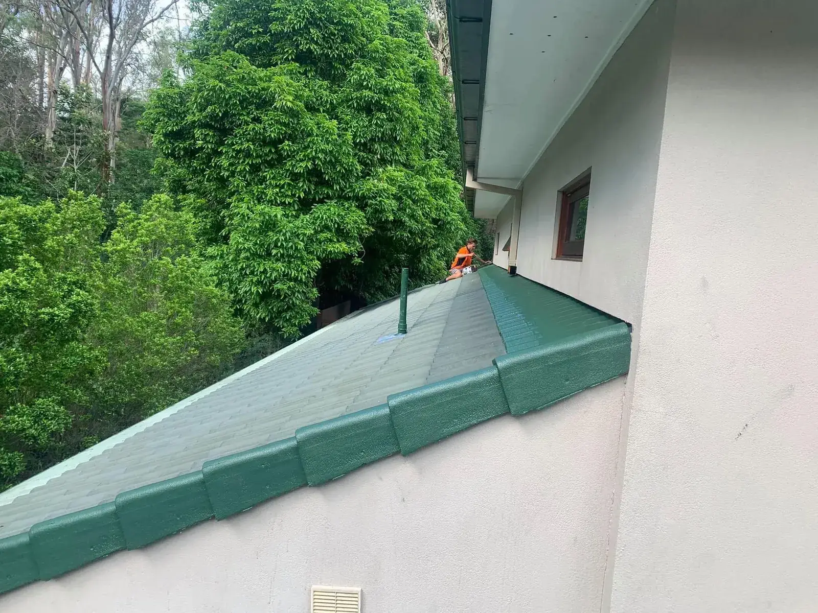 Gutter running along the edge of a tile roof