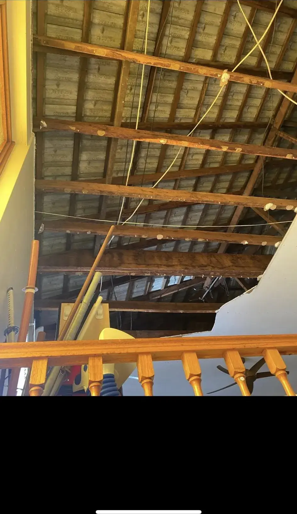 Ceiling lining down, showing the roof space above