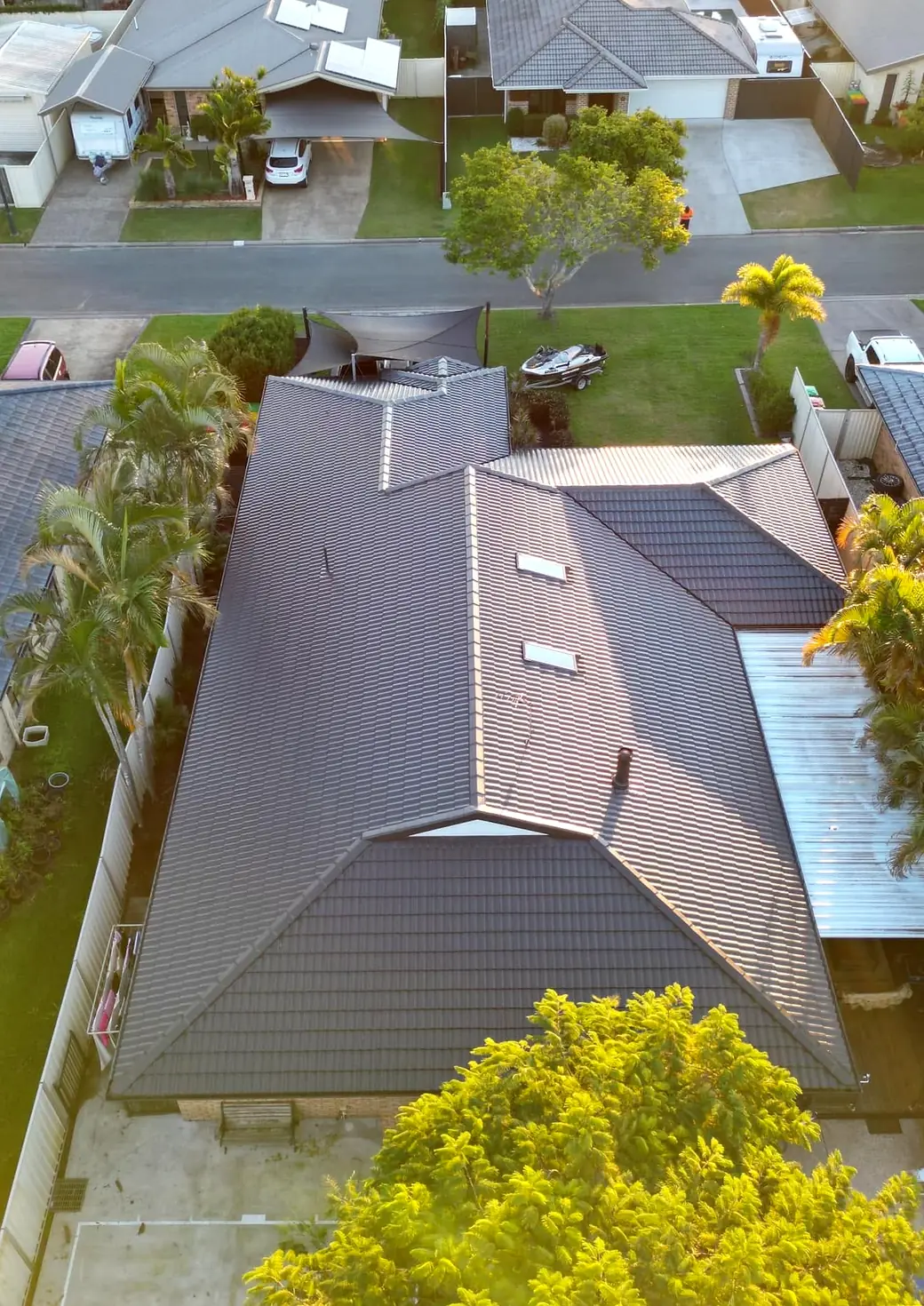 The same roof from the same spot after Everlong restored it, in an even dark coat